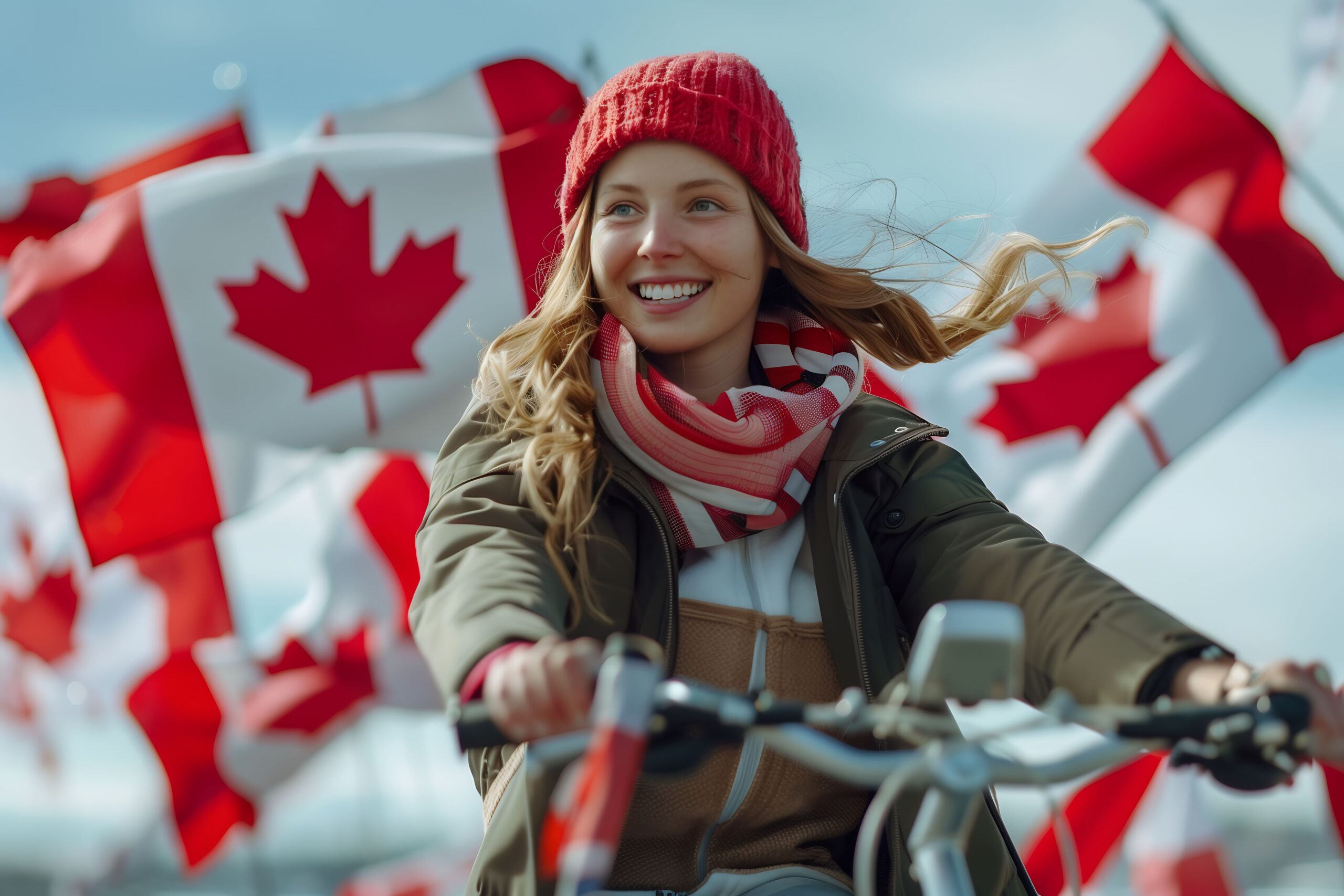 Jovem sorridente andando de bicicleta com jaqueta, touca e cachecol, cercada por bandeiras canadenses, representando o plano de imigrar para o Canadá.